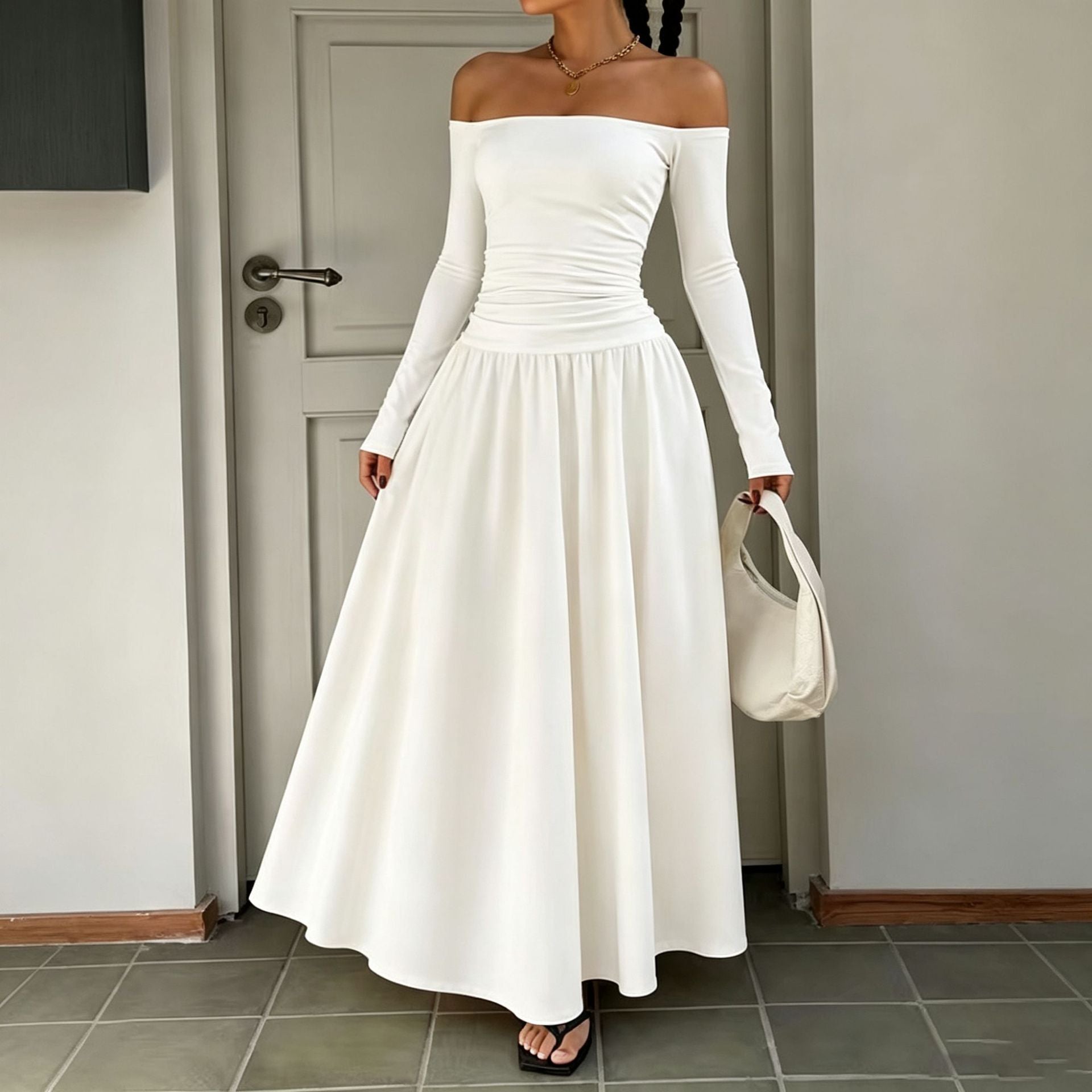 Waist-cinching long-sleeve off-shoulder boat-neck maxi dress